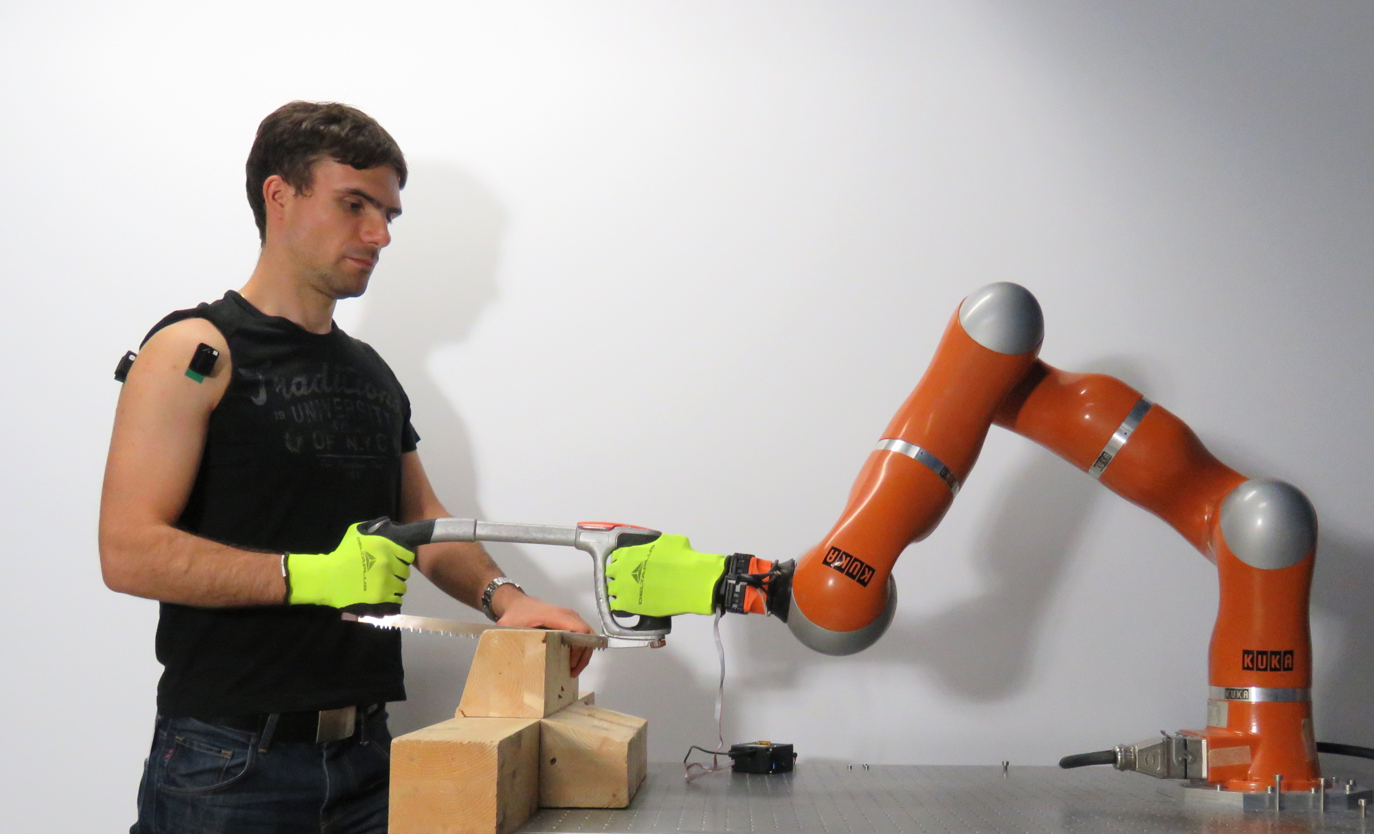 Human and collaborative robot working together in an industrial setting